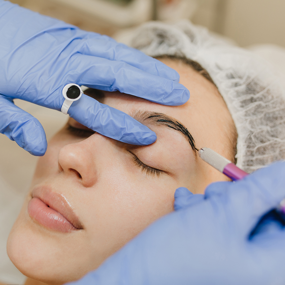 Portrait cosmetology procedures of pretty young woman in beauty salon. Dermatology procedure, botox eyebrows, hands in blue glows, at work, healthcare, therapy, beauty, rejuvenation. Portrait cosmetology procedures of pretty young woman in beauty salon. Dermatology procedure, botox eyebrows, hands in blue glows, at work, healthcare, therapy, beauty, rejuvenation